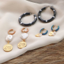 Inspiration pour styler vos boucles d&rsquo;oreilles cr&eacute;oles inox