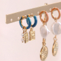 Inspiration pour styler vos boucles d&rsquo;oreilles cr&eacute;oles inox