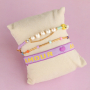 Utilisez ce joli ruban texte pour votre collection de bracelets 