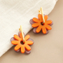 Comment cr&eacute;er des boucles d'oreilles avec des fleurs Polaris et des cr&eacute;oles DQ?